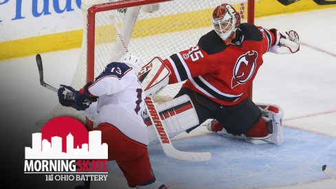 Cam Atkinson takes a shot against New Jersey Devils goaltender Cory Schneider