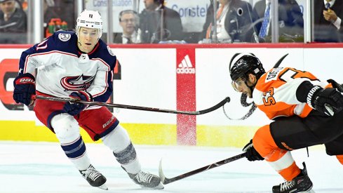 Matt Calvert goes for a puck against the Philadelphia Flyers 