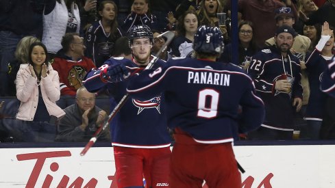 Pierre-Luc Dubois celebrates a goal with line mate Artemi Panarin