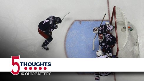 Scott Harrington tries to prevent Artem Anisimov to come to the net front