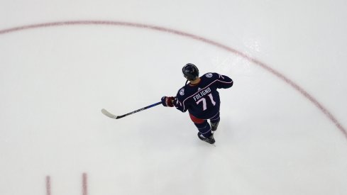 Nick Foligno stands alone on the ice during pre-game skate