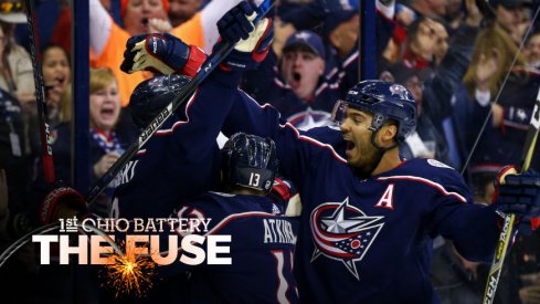 The Blue Jackets celebrate a goal by Zach Werenski against the Penguins.