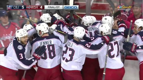 Blue Jackets mob Matt Calvert after his overtime winner in Game 2.