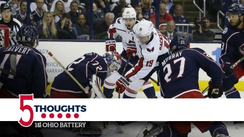 The Blue Jackets surround Sergei Bobrovsky in hopes of preventing a goal 