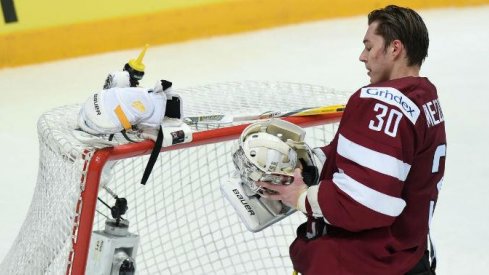 Elvis Merzlikins gets ready for a game as a goaltender for Latvia