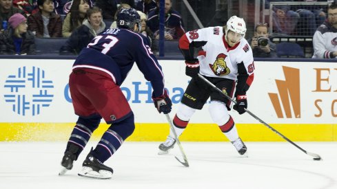 Ian Cole tries to stop Mike Hoffman in a late season game of the Blue Jackets against the Senators