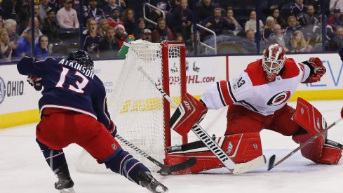 Columbus Blue Jackets forward Cam Atkinson tries to beat Hurricanes goaltender Scott Darling during a game at Nationwide Arena.