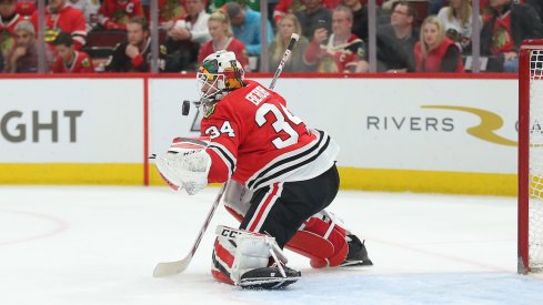 Goaltender Jean-Francois Berube stops a puck during one of his 13 appearances for the Chicago Blackhawks last season.