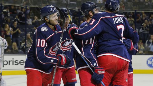 Alexander Wennberg and the Columbus Blue Jackets celebrate a power play goal scored against the Chicago Blackhawks at Nationwide Arena.