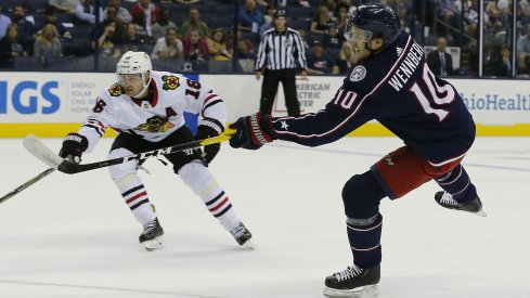 Alexander Wennberg shooting the puck