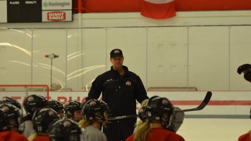 Andrew Cassels skates on the ice with the Ohio State Women's hockey team