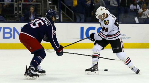 Columbus Blue Jackets defenseman Michael Prapavessis defends during a preseason game against the Chicago Blackhawks at Nationwide Arena.