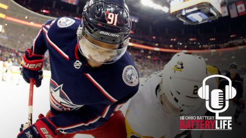 Anthony Duclair fights in the corner against a Pittsburgh Penguins defenseman