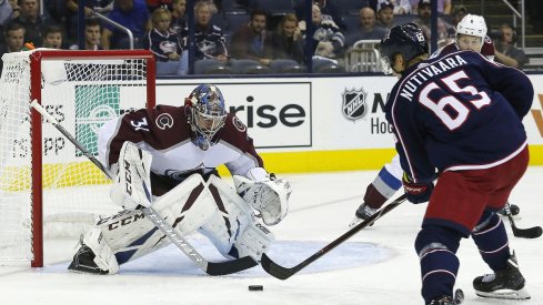 Columbus Blue Jackets defenseman Markus Nutivaara takes a shot on goal against Colorado Avalanche goaltender Philip Grubauer at Nationwide Arena.