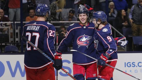 Ryan Murray, Markus Nutivaara and Artemi Panarin celebrate after a third period goal against the Colorado Avalanche on Tuesday.