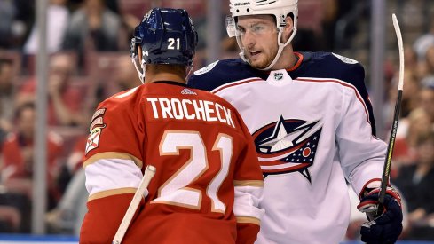 Pierre-Luc Dubois and Vincent Trocheck jaw back and forth during a game between the Columbus Blue Jackets and Florida Panthers