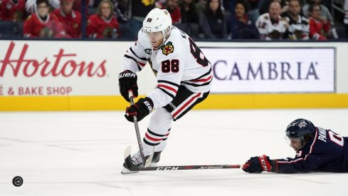 Patrick Kane beats Artemi Panarin down the ice and puts the puck on net.