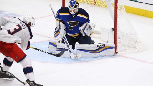 Columbus Blue Jackets defenseman Seth Jones scores a goal against Chad Johnson of the St. Louis Blues at Enterprise Center.