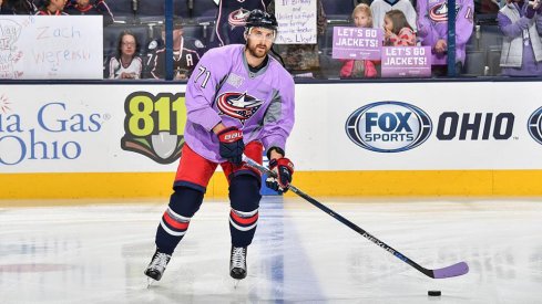 Nick Foligno skates pregame wearing a Hockey Fights Cancer jersey.