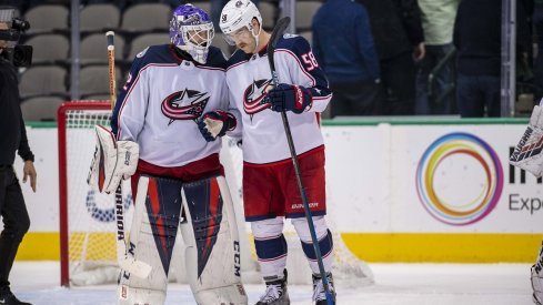 David Savard celebrates a big road win with Sergei Bobrovsky