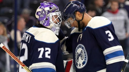 Columbus Blue Jackets defenseman Seth Jones celebrates a 4-2 win over the Minnesota Wild with goaltender Sergei Bobrovsky.