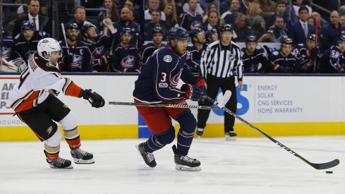 Seth Jones is stick-checked by Adam Henrique as the Blue Jackets dropped a 2-1 game in overtime to the Anaheim Ducks