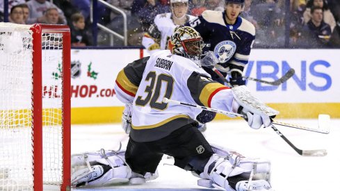 Columbus Blue Jackets center Lukas Sedlak drives the net against Vegas Golden Knights goaltender Malcolm Subban at Nationwide Arena.