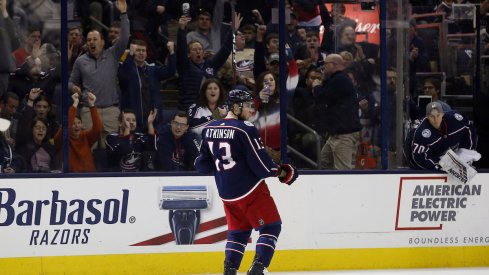 Cam Atkinson reacts to scoring a goal at Nationwide Arena.