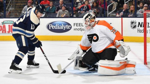 Cam Atkinson faces off against Flyers goalie Calvin Pickard