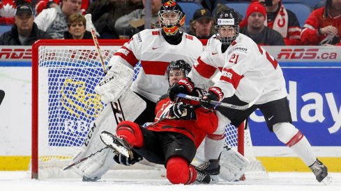 Blue Jackets prospect Tim Berni lays out Taylor Raddysh in front of the net at the 2018 World Junior Championship 