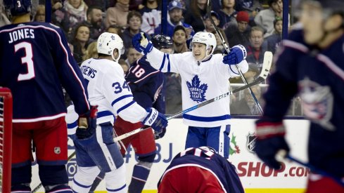 Mitch Marner and Auston Matthews celebrate a goal in a 4-2 win over the Columbus Blue Jackets