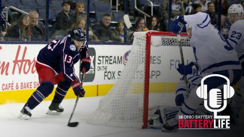 Cam Atkinson tries to find a play to make behind the net against the Toronto Maple Leafs