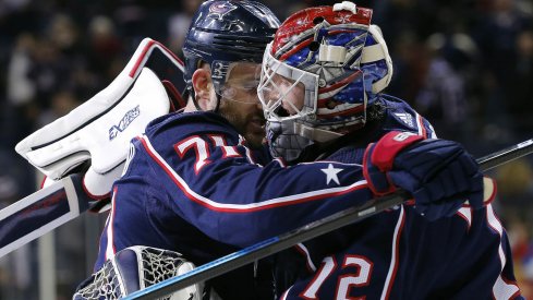 Nick Foligno and Sergei Bobrovsky hug it out following a win over the New York Rangers.