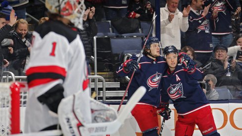 Artemi Panarin and Cam Atkinson celebrate scoring against the New Jersey Devils