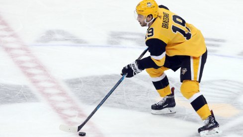 Pittsburgh Penguins center Derick Brassard skates with the puck during a game at PPG Paints Arena.