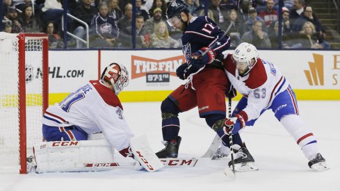 Columbus Blue Jackets center Brandon Dubinsky drives the Montreal Canadiens net guarded by Carey Price during a game at Nationwide Arena.