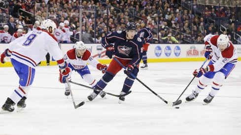 Zach Werenski tries to skate through multiple Montreal Canadiens