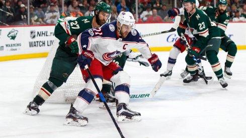 Nick Foligno carries the puck against the Minnesota Wild 