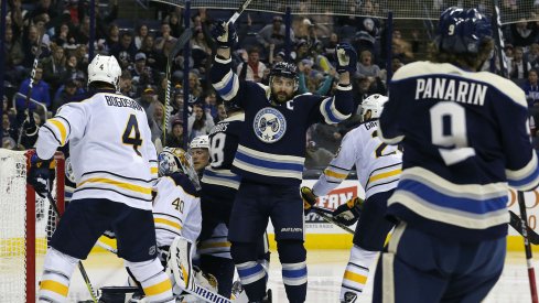 Nick Foligno celebrates a second period power play goal with Artemi Panarin