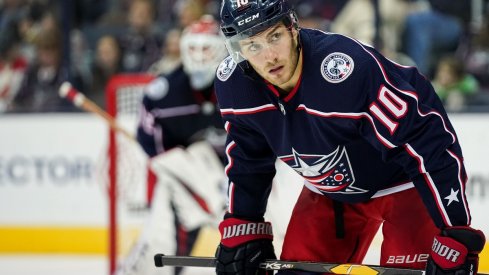 Alexander Wennberg looks to win a faceoff against the Chicago Blackhawks at Nationwide Arena. 