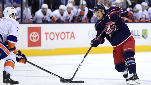 Cam Atkinson shoots the puck against the New York Islanders.