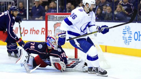 Nikita Kucherov of the Tampa Bay Lightning scores a goal against Columbus Blue Jackets goaltender Joonas Korpisalo during a game at Nationwide Arena.