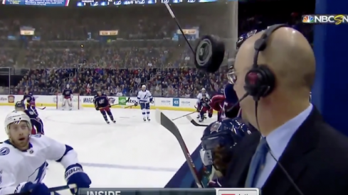 Pierre McGuire narrowly escapes disaster during Monday's game between the Blue Jackets and Lightning at Nationwide Arena.