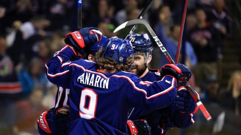 Columbus Blue Jackets forwards Artemi Panarin and Nick Foligno celebrate a goal against the San Jose Sharks at Nationwide Arena.