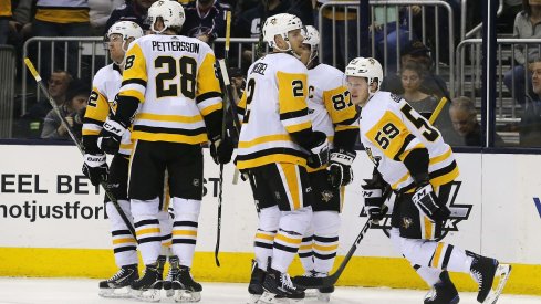 Jake Guentzel and the Penguins celebrate a goal against the Columbus Blue Jackets at Nationwide Arena