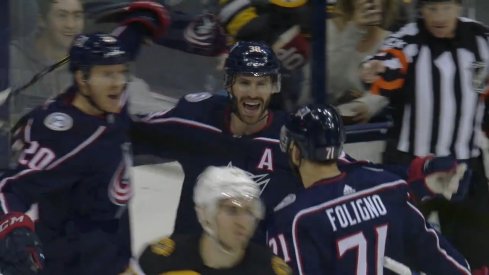 Columbus Blue Jackets center Boone Jenner celebrates the 100th goal of his NHL career with Nick Foligno and Riley Nash.