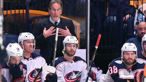 John Tortorella demands an explanation from the refs after a particularly contentious play.