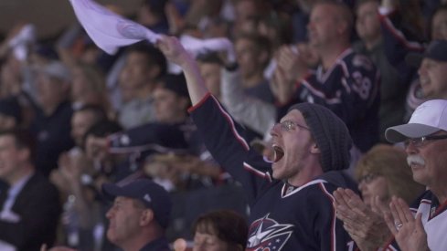 A fan celebrates during the Blue Jackets Game 4 win over the Tampa Bay Lightning