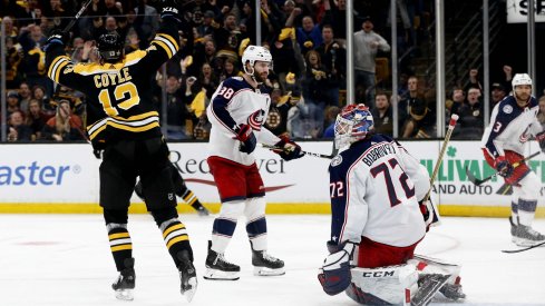 Apr 25, 2019; Boston, MA, USA; Boston Bruins center Charlie Coyle (13) celebrates after scoring the game winning against Columbus Blue Jackets goaltender Sergei Bobrovsky (72) during the overtime period in game one of the second round of the 2019 Stanley Cup Playoffs at TD Garden.