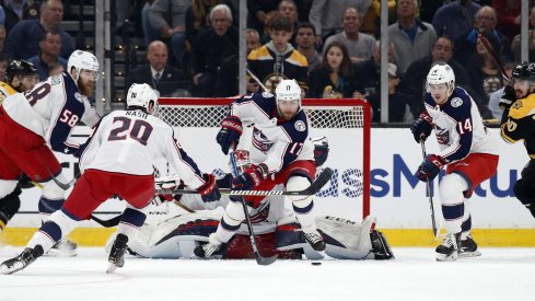 Apr 25, 2019; Boston, MA, USA; Columbus Blue Jackets center Brandon Dubinsky (17) clears the puck away from goaltender Sergei Bobrovsky (72) against the Boston Bruins during the first period in game one of the second round of the 2019 Stanley Cup Playoffs at TD Garden.